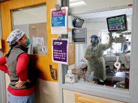 Rebecca Martin PA, has Sharon Gonsalves RN, show her the screen with the vitals for a COVID-19 positive patient in the ICU at the Charlton Memorial Hospital in Fall River.  PHOTO PETER PEREIRA