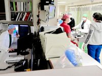 Dr. Joseph Tondreau, speaks into his dictation software, left, as nurses discuss patients in the ED at the Charlton Memorial Hospital in Fall River.  PHOTO PETER PEREIRA