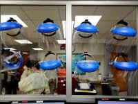 A nurse walks past the individually assigned face shields at the Charlton Memorial Hospital in Fall River.  PHOTO PETER PEREIRA