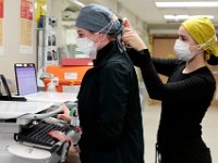 Clinical techs, Alexandra Debonis and Andrea Ramos fix each others hats at the Charlton Memorial Hospital in Fall River.  PHOTO PETER PEREIRA