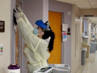 Megan Sweeney RN, documents at what time medication was given to the COVID-19 positive patient at the Charlton Memorial Hospital in Fall River.  PHOTO PETER PEREIRA