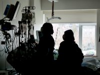 Two nurses check the vitals of a patient at the Charlton Memorial Hospital in Fall River.  PHOTO PETER PEREIRA