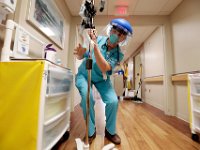 Dorothy Cicchatti, RN, clenas the IV pump stand at Tobey Hospital in Wareham.  PHOTO PETER PEREIRA