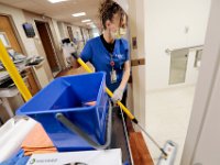 Betty Martins, cleans one of the bathrooms in the SK2 wing at Tobey Hospital in Wareham.  PHOTO PETER PEREIRA]