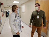 Nurse manager, Tina Jones, speaks with Justin Lapris, the only social worker at the hospital, about a patient that she needs him to speak with at Tobey Hospital in Wareham.  PHOTO PETER PEREIRA