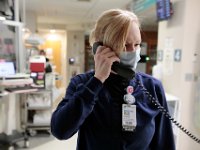 Kristine Tavares, radiology imaging technologist, calls to see if the incoming patient is COVID-19 positive at Tobey Hospital in Wareham.  PHOTO PETER PEREIRA