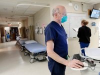 Brian Lenahan, RN, enters information of a recently admitted patient to the ER at Tobey Hospital in Wareham.  PHOTO PETER PEREIRA