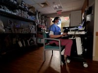 Rebecca Ostapchuk, safety sitter, monitors her patients behavior at Tobey Hospital in Wareham.  PHOTO PETER PEREIRA