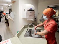 Anna Sousa, huc/na washes her hands before leaving after her shift in the ICU at Tobey Hospital in Wareham. PHOTO PETER PEREIRA