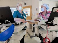 Respiratory therapists, Mary MacLeod, left, and Paul St.Germain, monitor a COVID-19 patient in the ICU at Tobey Hospital in Wareham.  PHOTO PETER PEREIRA
