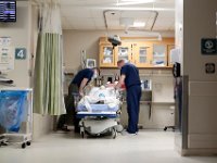 Laurie Trask monitors a man entering the hospital at station set up at the entrance to the emergency room at Tobey Hospital in Wareham.  PHOTO PETER PEREIRA