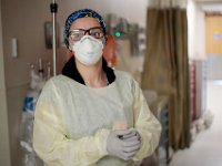 Katelin Arruda, nurse tech, prepares to enter a COVID-19 positive patients room at Tobey Hospital in Wareham.  PHOTO PETER PEREIRA
