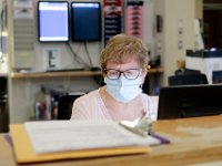 ER health unit coordinator, Donna Sommers, at the nurses station at Tobey Hospital in Wareham.  PHOTO PETER PEREIRA]