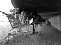 Max, 30, carries his possessions under the pedestrian overpass on Route 18 in the south end of New Bedford where he will live for the next few days.  Max and his girlfriend, who is also homeless, were forced out of an area where they had set up a tent at the Ben Rose Field Park. Once again, he and his girlfriend are looking for a place to call home.   PHOTOS PETER PEREIRA