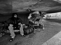 Max, 30, sits atop his possessions under the pedestrian overpass on Route 18 in the south end of New Bedford where he will live for the next few days.  Max and his girlfriend, who is also homeless, were forced out of an area where they had set up a tent at the Ben Rose Field Park. Once again, he and his girlfriend are looking for a place to call home.   PHOTOS PETER PEREIRA