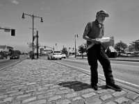 With a box containing breakfast that a motorist gave him, Robert Stone Jr. panhandles at the intersection of Union Street and Route 18 in downtown New Bedford.  [ PETER PEREIRA/THE STANDARD-TIMES/SCMG ]