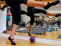 Participants in the morning session use the barre at The Barre Fitness Studio on Union Street in New Bedford.  [ PETER PEREIRA/THE STANDARD-TIMES/SCMG ]