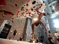 Climbers look on as John Vigeant is supended in the air as he makes his way up an inverted section at Carabiner's Climbing and Fitness in New Bedford.  [ PETER PEREIRA/THE STANDARD-TIMES/SCMG ]