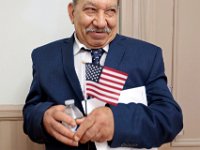 New United States citizen, Abdelmesih Meleik Agban, who was born in Egypt,  is delighted after receiving his citizenship certificate at the naturalization service held at the Immigrants Assistance Center on Crapo Street in New Bedford.  [ PETER PEREIRA/THE STANDARD-TIMES/SCMG ]