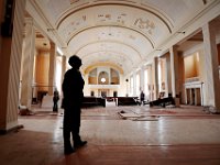 Mayor Jon Mitchell takes a closer look at the inside of the Sant Anne Church, before it is demolished to make way for the future Public Safety Center on Brock Avenue in the south end of New Bedford.  [ PETER PEREIRA/THE STANDARD-TIMES/SCMG ]