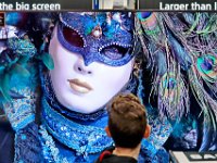 A youngster pauses to take in one of the new 8K TV's for sale at Best Buy in Dartmouth on Black Friday. [ PETER PEREIRA/THE STANDARD-TIMES/SCMG ]