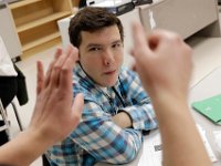 Austin Velho, 17, pays attention to Meghan Silvia, conducting her class with three deaf students at the Keith Middle School in New Bedford, MA on January 24, 2019.