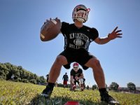 Running back Dylan DeWolfe, 18, llines up behind quarterback Noah Maxwell as Old Rochester Regional High School football team conduct their first practice of the season on August 16, 2019.