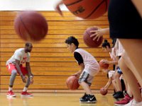 Youngsters practice their dribbling skills at the Future of New Bedford Basketball Clinic which started today and will run for the rest of the week inside the New Bedford High School gym.  [ PETER PEREIRA/THE STANDARD-TIMES/SCMG ]