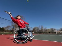 Michael Lipp sends the ball into the air for the serve as he plays a match of doubles tennis with Laura Casey, against Tina Andrade, left, and Susan Garstang, right, at the tennis courts at Fort Phoenix in Fairhaven.  [ PETER PEREIRA/THE STANDARD-TIMES/SCMG ]