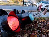 The traffic lights are still operational after being knocked down by a vehicle at the intersection of Hawthorn and Cottage Streets in New Bedford.  [ PETER PEREIRA/THE STANDARD-TIMES/SCMG ]