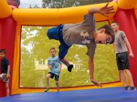 Jackson Houle, 6, finds himself suspended midair as he and other children jump inside the bounce house on Family Fun day as part of the Fairhaven Office of Tourism Monday Morning Fun programs which run from July to August.   [ PETER PEREIRA/THE STANDARD-TIMES/SCMG ]