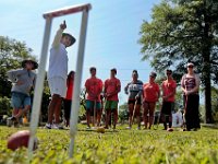 International and American Croquet Champion Sherif Abdelwahab, is seen through a wicket, as he explains the rules of croquet to participants from the Community Boating Center during a demontration of the sport at Hazelwood Park in the south end of New Bedford. [ PETER PEREIRA/THE STANDARD-TIMES/SCMG ]