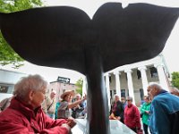 New Bedford Whaling National Historical Park ranger, Lucy Bly stops tourists in front of the whale-tale sculpture on N Water Street in downtown New Bedford, to speak about the city's long history of whaling. [ PETER PEREIRA/THE STANDARD-TIMES/SCMG ]