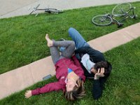 Amanda Ormseth and Garrett Gunderson enjoy each others company and the excellent weather, after riding their bikes to the Custom House Square in downtown New Bedford.  [ PETER PEREIRA/THE STANDARD-TIMES/SCMG ]