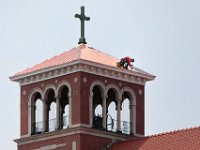 A roofer finds himself high above Acushnet, as he installs a new copper roof on the bell tower of the St. Francis Xavier Parish Church.  [ PETER PEREIRA/THE STANDARD-TIMES/SCMG ]