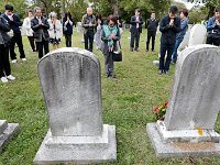 Visitors from Tosashimizu, Japan pay their respects to Capt. William Whittfield buried at the Riverside Cemetery in Fairhaven.  Capt. Whitfield was responsible for bringing the first Japanese person to the United States in 1843, when his whaling ship rescued Nakahama Manjiro during a whaling voyage in the Pacific.  This group hails from the Manjiro's hometown in Tosashimizu, Japan, and came to Fairhaven for the Manjiro Festival Tour, celebrating the steps taken by the first Japanese person to live in the United States. [ PETER PEREIRA/THE STANDARD-TIMES/SCMG ]