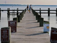 Two men enjoy a morning of fishing off a pier in the south end of New Bedford.  [ PETER PEREIRA/THE STANDARD-TIMES/SCMG ]