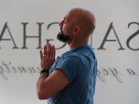 Jeff Costa, co-owner, meditates during a yoga session at the new Sangha New Bedford which has opened at 693 Purchase Street in downtown New Bedford at the old Edison Light Building.