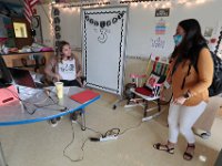 New teacher, Courtney Lima shows second grade paraprofessional Jessica DeSouza the t-shirt she made to celebrate her first day as a teacher. Courtney Lima who attended the Taylor School in New Bedford as a student for grades K-6, returns for her first day of school, this time as a third grade teacher. Ms. Lima will be teaching third graders virtually this year, as part of the Distance Learning Academy for students who opted to stay home for this school year.  PHOTO PETER PEREIRA