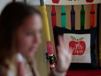 A pillow made for her by her grandmother sits on a chair she painted in the hopes of reading to her students, while explaining what a student must do if they have a question to ask. Courtney Lima who attended the Taylor School in New Bedford as a student for grades K-6, returns for her first day of school, this time as a third grade teacher. Ms. Lima will be teaching third graders virtually this year, as part of the Distance Learning Academy for students who opted to stay home for this school year.  PHOTO PETER PEREIRA