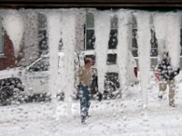 1007028856 ma nb snowStorm  Two men walk across N Water Street in New Bedford, MA as seen through the frozen window pane of the Tia Maria's Cafe, as a snow storm sweeps across the region.   PETER PEREIRA/THE STANDARD-TIMES/SCMG : weather, snow, storm, blizzard