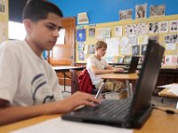 ma nb_ N8A0474  Oswaldo Mariscal, 15, and David Lima, 16, work on researching their project on the whaleship Essex in history class at the Whaling City Alternative School in New Bedford.   PETER PEREIRA/THE STANDARD-TIMES/SCMG : education, school, class, classroom, work