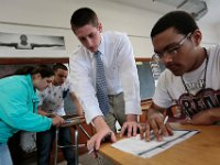 ma nb_ N8A0500  Courtney Teves, 15, and Christian Castro, 17, work together on their extra help math class as teacher Tim Clifford gives Severn Williams 17, a hand with his work at the Whaling City Alternative School in New Bedford.   PETER PEREIRA/THE STANDARD-TIMES/SCMG : education, school, class, classroom, work