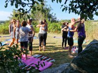 Participants start the yoga session with a hug before Instructor Tracy Clarke, leads participants in a yoga classs as part of the Summer Yoga Series held at the DNRT  Slocums River Reserve on Horseneck Road in Dartmouth.   [ PETER PEREIRA/THE STANDARD-TIMES/SCMG ]