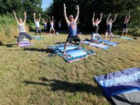 Instructor Tracy Clarke, leads participants in a yoga classs as part of the Summer Yoga Series held at the DNRT  Slocums River Reserve on Horseneck Road in Dartmouth.   [ PETER PEREIRA/THE STANDARD-TIMES/SCMG ]