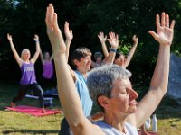 Instructor Tracy Clarke, leads participants in a yoga classs as part of the Summer Yoga Series held at the DNRT  Slocums River Reserve on Horseneck Road in Dartmouth.   [ PETER PEREIRA/THE STANDARD-TIMES/SCMG ]