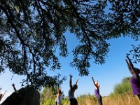 Instructor Tracy Clarke, leads participants in a yoga classs as part of the Summer Yoga Series held at the DNRT  Slocums River Reserve on Horseneck Road in Dartmouth.   [ PETER PEREIRA/THE STANDARD-TIMES/SCMG ]