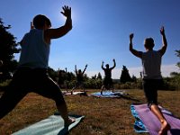 Instructor Tracy Clarke, leads participants in a yoga classs as part of the Summer Yoga Series held at the DNRT  Slocums River Reserve on Horseneck Road in Dartmouth.   [ PETER PEREIRA/THE STANDARD-TIMES/SCMG ]