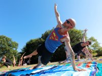 David Finn-Clarke strikes a yoga pose with fellow participants in a yoga classs as part of the Summer Yoga Series held at the DNRT  Slocums River Reserve on Horseneck Road in Dartmouth.   [ PETER PEREIRA/THE STANDARD-TIMES/SCMG ]