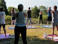 Instructor Tracy Clarke, leads participants in a yoga classs as part of the Summer Yoga Series held at the DNRT  Slocums River Reserve on Horseneck Road in Dartmouth.   [ PETER PEREIRA/THE STANDARD-TIMES/SCMG ]